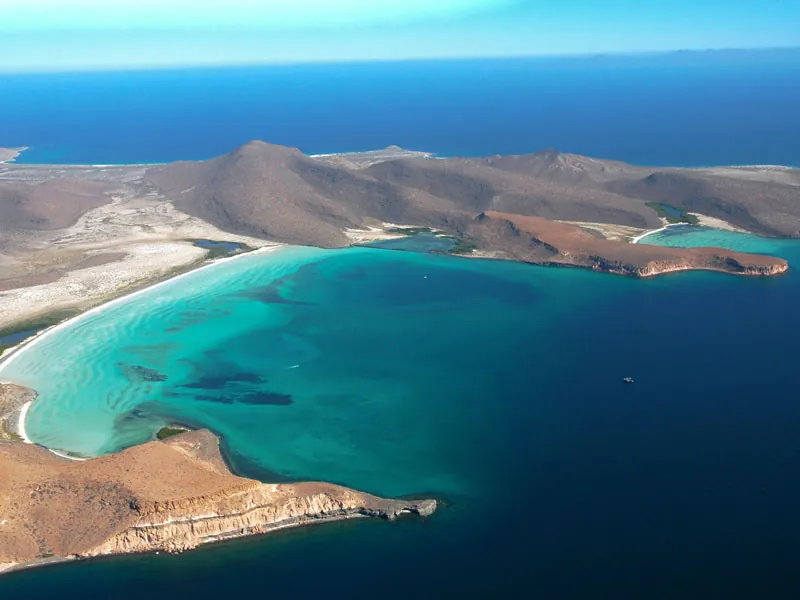 Aerial view of turquoise bays, white sand and desert hills on the Sea of Cortés coast
