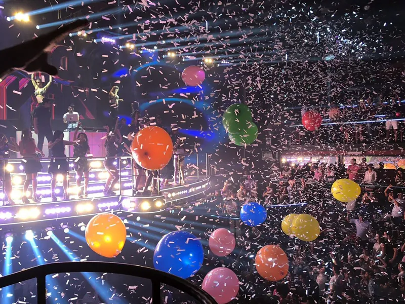 Confetti and giant balloons falling over the stage and dance floor at Coco Bongo