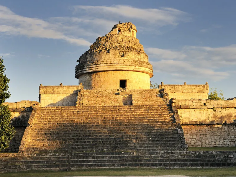 The round observatory of El Caracol at Chichén Itzá lit by warm late-afternoon sun