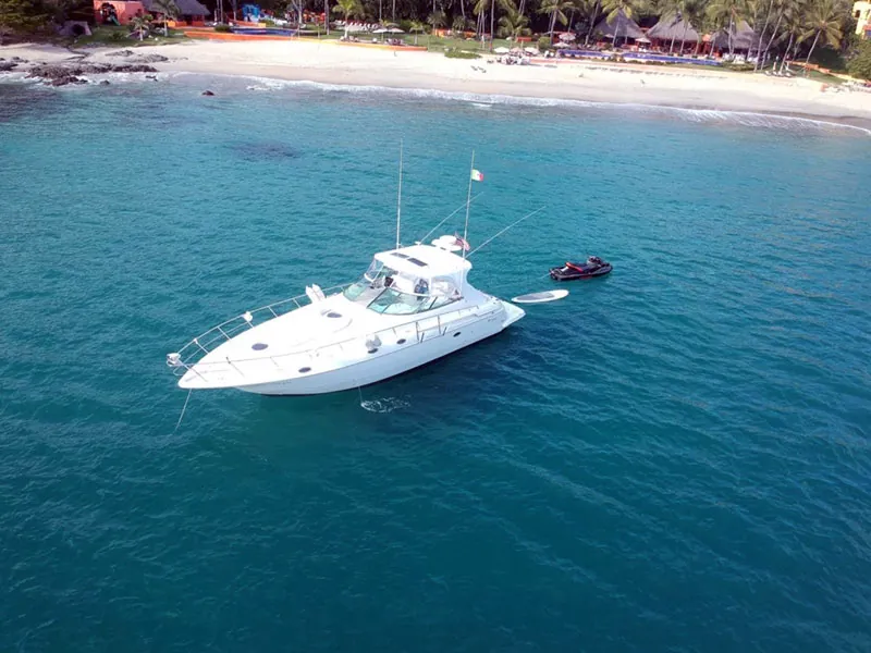 Fishing yacht anchored in clear turquoise water