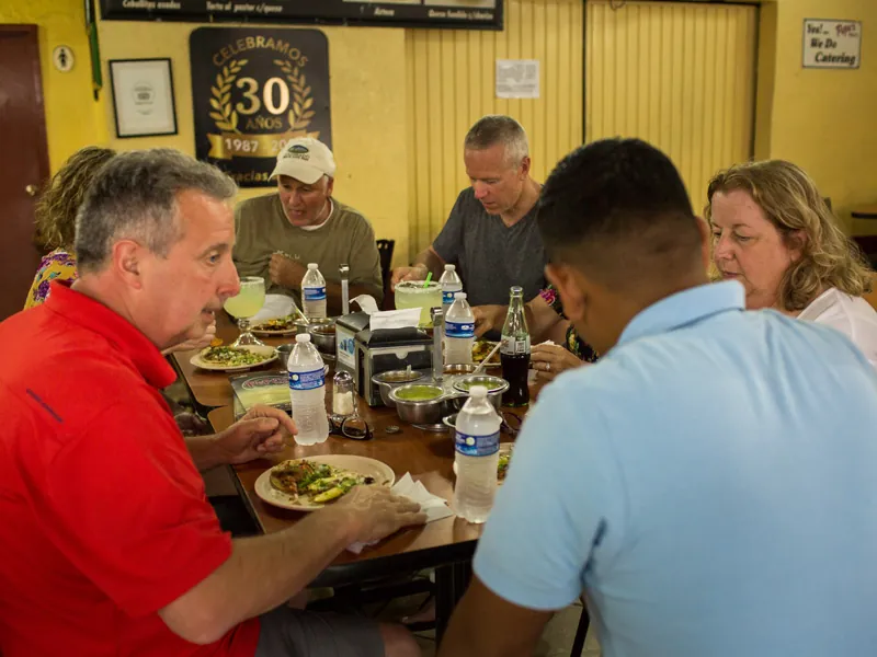 Guests sharing tacos at a local taquería