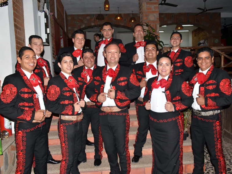 Mariachi band in red and black charro suits