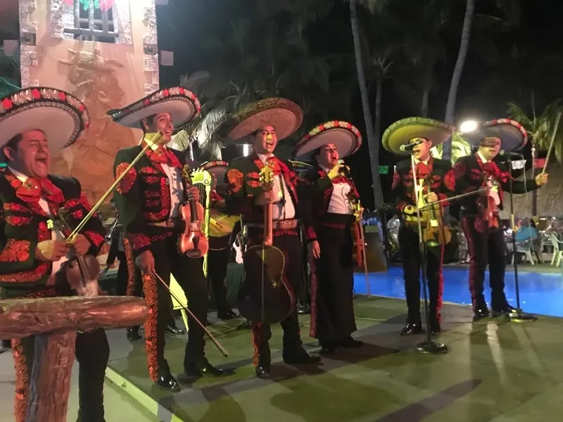 Mariachi band performing at an evening event
