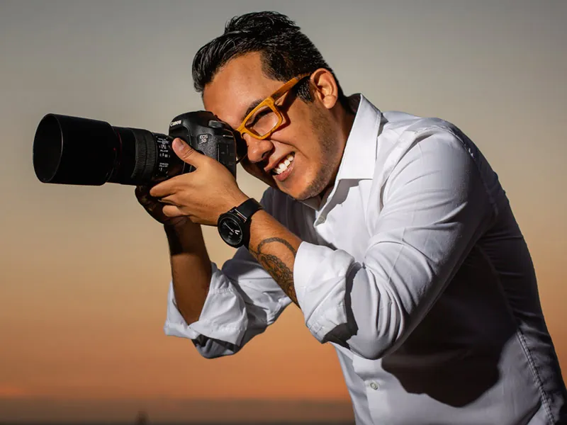 Photographer shooting with a professional camera