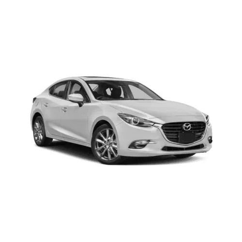 A silver four-door sedan available with a private driver for evenings out in Cancún