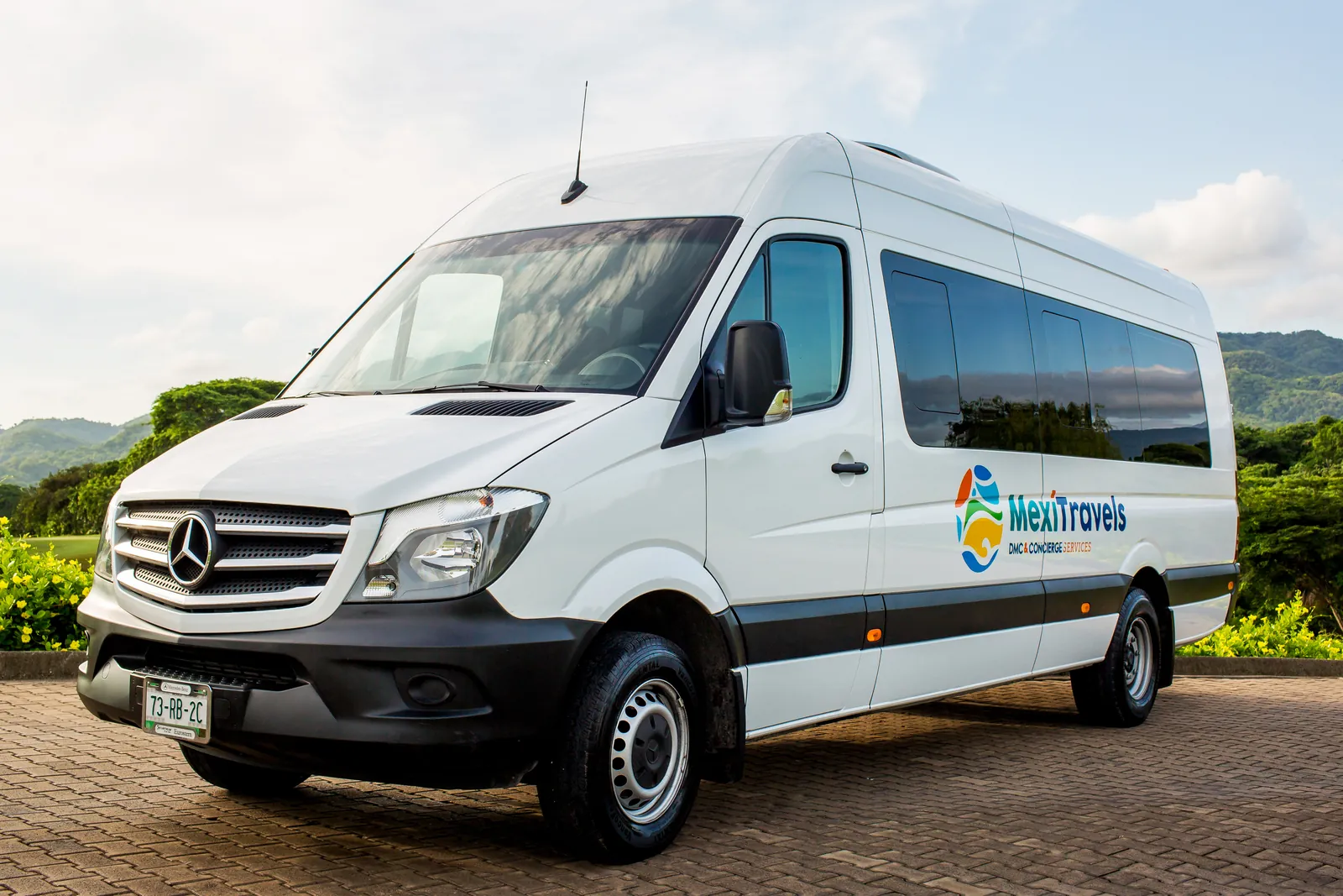 White Mercedes Sprinter van for group airport transfers
